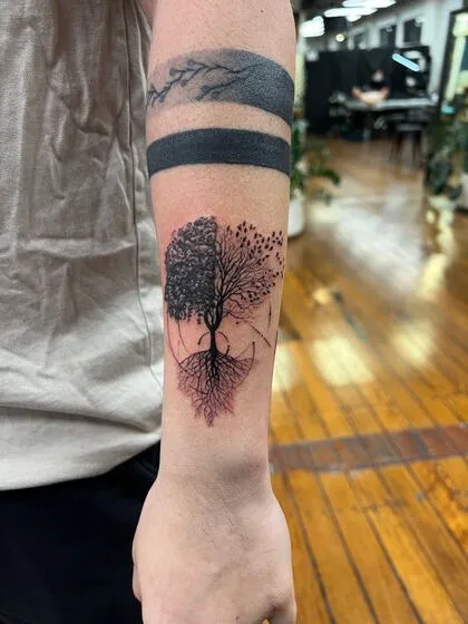 Fine line tree of life with two seasons on the forearm