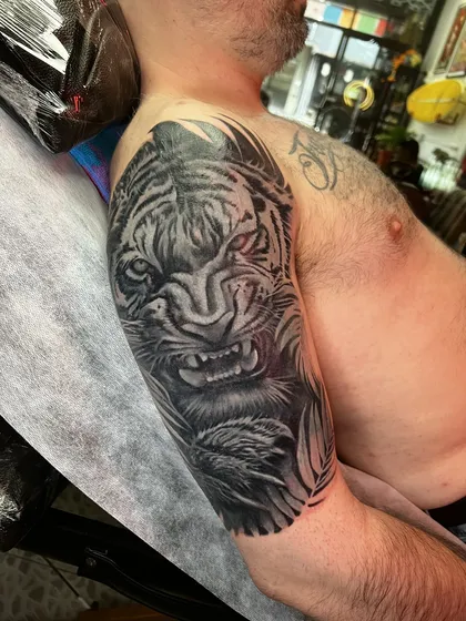 Side view of the tiger cover-up on the upper arm