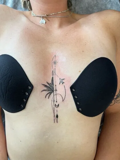 Fine line tropical travel sternum tattoo