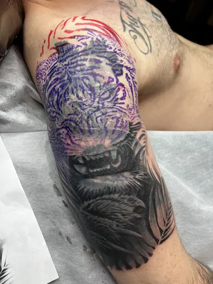 Purple stencil of a tiger drawn over the old tattoo before tattooing