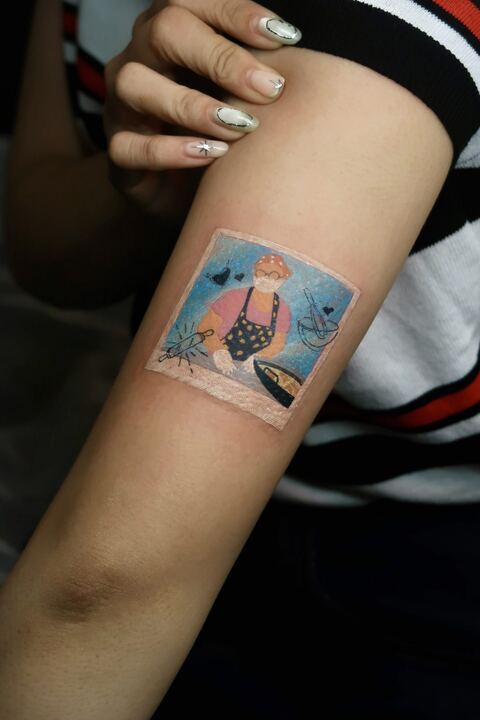 Colour photo-style tattoo