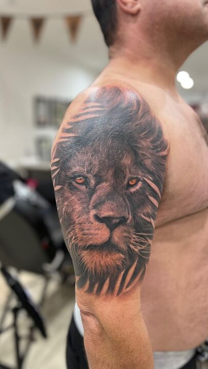 Lion shoulder tattoo